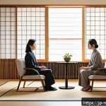 정신건강 상담사의 역할 - A serene counseling room setting in a modern Japanese office, featuring a calm female mental health ...